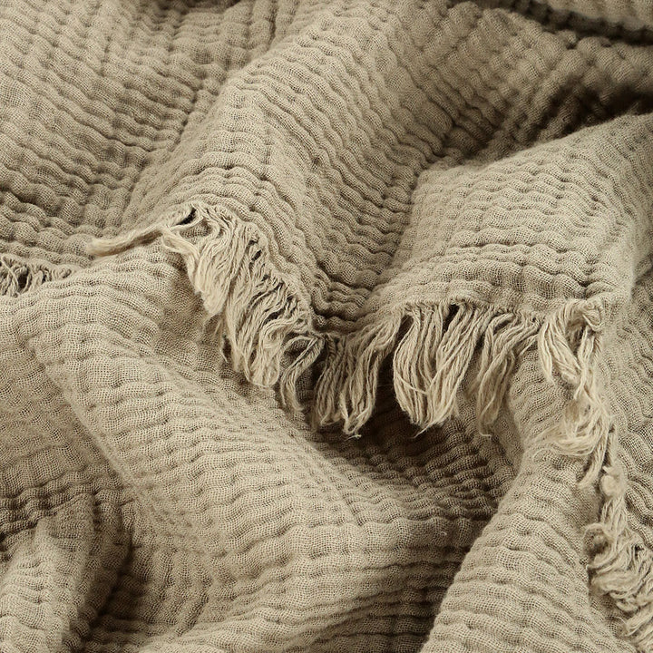 4-layered Muslin Throw Blanket made from 100% natural cotton. Soft, breathable, and lightweight Turkish throw for bedding, sofa, home decor, or gifting.