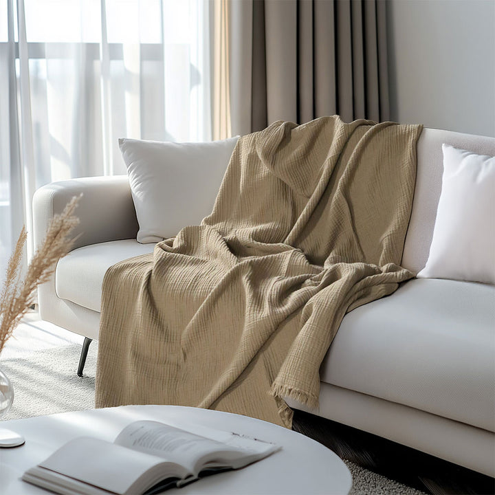 4-layered Muslin Throw Blanket made from 100% natural cotton. Soft, breathable, and lightweight Turkish throw for bedding, sofa, home decor, or gifting.